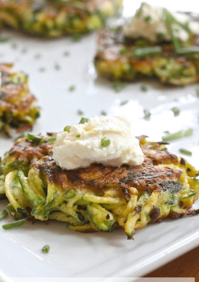 Zucchini Fritters with Lemon Ricotta on white plate